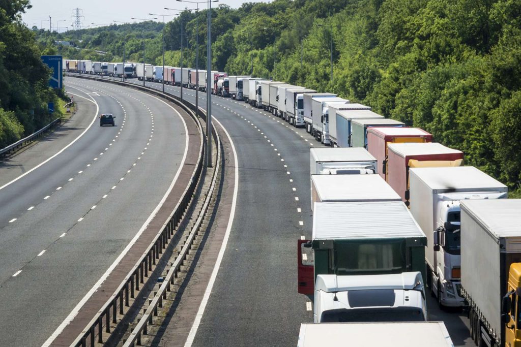 HGV trucks queueing on a motorway