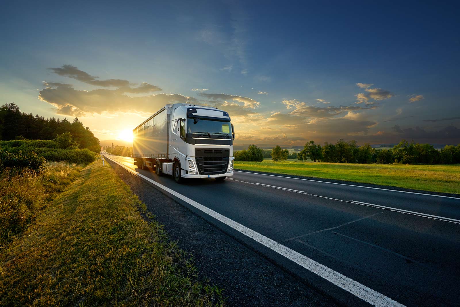 A HGV truck at sunrise or sunset